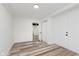 Versatile room with ample natural light and wood floors, offering flexibility for any lifestyle at 233 N Devon Ave, Indianapolis, IN 46219