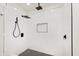 Modern shower with white subway tile, black fixtures, and a tiled floor, offering a stylish upgrade at 233 N Devon Ave, Indianapolis, IN 46219