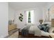 The staged bedroom includes a large window and soothing decor, making it a relaxing retreat at 2631 Collier St, Indianapolis, IN 46241