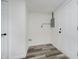 Bright laundry area with wood-look floors and white appliances hookups at 2631 Collier St, Indianapolis, IN 46241