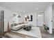 Bright living room features neutral decor, modern lighting, and an area rug at 2631 Collier St, Indianapolis, IN 46241