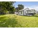 This single-story home boasts a spacious, well-maintained yard and a clean exterior at 2631 Collier St, Indianapolis, IN 46241
