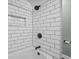 Elegant bathroom with white subway tile, a black shower head and faucet, and a built-in niche at 2645 Washington St, Columbus, IN 47201