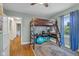 Stylish bedroom featuring a unique lofted bed, desk and ample natural light at 2645 Washington St, Columbus, IN 47201