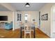 Cozy dining area with hardwood floors, a table, and a hutch at 2645 Washington St, Columbus, IN 47201