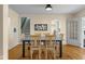 Bright dining room with hardwood floors, a dining table, and access to other living spaces at 2645 Washington St, Columbus, IN 47201