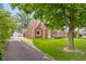 Charming brick home featuring a well-manicured lawn and inviting front entrance at 2645 Washington St, Columbus, IN 47201