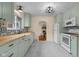 Stylish kitchen featuring green cabinets, butcher block countertops, and modern appliances at 2645 Washington St, Columbus, IN 47201