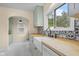 Charming kitchen with light green cabinets, butcher block countertops, and stainless steel appliances at 2645 Washington St, Columbus, IN 47201
