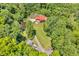 Expansive property featuring a home, garage, pond, and lush green surroundings from above at 2780 W Grizzly Trl, Martinsville, IN 46151