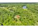 A sprawling property with a cozy house, a serene pond, and abundant greenery, offering privacy at 2780 W Grizzly Trl, Martinsville, IN 46151