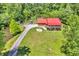 Beautifully landscaped property with a charming house, lush green lawn and private driveway at 2780 W Grizzly Trl, Martinsville, IN 46151