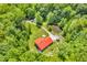 Stunning aerial view captures a charming house nestled amid lush greenery with a serene pond nearby at 2780 W Grizzly Trl, Martinsville, IN 46151