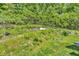 Backyard features a lush, green, sloped lawn with a large propane tank at 2780 W Grizzly Trl, Martinsville, IN 46151