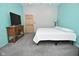 Cozy bedroom with carpet and a TV, featuring a simple, modern bed at 2780 W Grizzly Trl, Martinsville, IN 46151