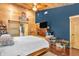 Cozy bedroom with hardwood floors, wood paneling, and a sliding barn door at 2780 W Grizzly Trl, Martinsville, IN 46151