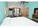 Bright bedroom featuring chairs by the window, an open door, and light blue accent walls at 2780 W Grizzly Trl, Martinsville, IN 46151