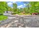 Long driveway leading to a home with a detached garage and ample parking space at 2780 W Grizzly Trl, Martinsville, IN 46151