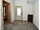 Bright entryway featuring a modern door and trim, with adjacent doors for convenience at 2780 W Grizzly Trl, Martinsville, IN 46151