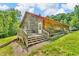 Charming log home with a deck and hot tub, providing an inviting outdoor relaxation space at 2780 W Grizzly Trl, Martinsville, IN 46151