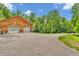 Exterior view of a log cabin style home with a two-car garage at 2780 W Grizzly Trl, Martinsville, IN 46151