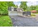 Spacious detached two-car garage with dormers and ample parking surrounded by lush greenery at 2780 W Grizzly Trl, Martinsville, IN 46151