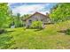 Spacious log home with well-maintained lawn and landscaped yard, offering a serene and private setting at 2780 W Grizzly Trl, Martinsville, IN 46151