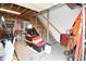 Unfinished garage space showing storage with stairs leading up to potential living space above at 2780 W Grizzly Trl, Martinsville, IN 46151