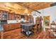 Well-equipped kitchen with custom cabinets, an island, and hardwood floors at 2780 W Grizzly Trl, Martinsville, IN 46151