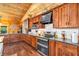 Well-equipped kitchen boasting wood cabinets, modern appliances, and ample counter space for cooking at 2780 W Grizzly Trl, Martinsville, IN 46151