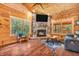 Bright living room with a stone fireplace, natural light, and comfortable seating at 2780 W Grizzly Trl, Martinsville, IN 46151