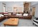 Cozy living room with a large sectional, wooden accents, and decorative pillows at 2780 W Grizzly Trl, Martinsville, IN 46151