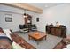 Inviting living room with a leather couch, pumpkin decor, and a bookshelf at 2780 W Grizzly Trl, Martinsville, IN 46151
