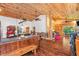 Open-concept living room with wood floors, ceiling, and a unique tree-like design feature at 2780 W Grizzly Trl, Martinsville, IN 46151