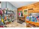 Rustic mudroom features tile floors, wood walls, and a large shelving unit for storage at 2780 W Grizzly Trl, Martinsville, IN 46151