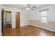 Classic bedroom with hardwood floors, ceiling fan, and natural light at 2905 N Warman Ave, Indianapolis, IN 46222