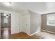 Bright bedroom with hardwood floors, closet, and natural light from the window at 2905 N Warman Ave, Indianapolis, IN 46222