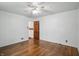 Another view of bedroom showcasing hardwood floors and natural light, with a glimpse into a bathroom at 2905 N Warman Ave, Indianapolis, IN 46222