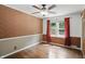 Comfortable bedroom featuring a window with natural light and a classic wall decor at 2905 N Warman Ave, Indianapolis, IN 46222