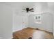 Bedroom featuring hardwood floors, a ceiling fan, closet, and a window at 2905 N Warman Ave, Indianapolis, IN 46222