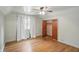 Bedroom with hardwood floors, window with curtains and a closet at 2905 N Warman Ave, Indianapolis, IN 46222