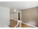 Upstairs hallway featuring hardwood floors and an open room perfect for storage at 2905 N Warman Ave, Indianapolis, IN 46222