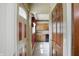 View of the kitchen from a doorway with wooden cabinets and older appliances at 2905 N Warman Ave, Indianapolis, IN 46222