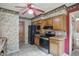 This kitchen offers lots of natural light, stainless steel appliances and wooden cabinetry at 2905 N Warman Ave, Indianapolis, IN 46222