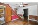 Spacious living room with staircase, hardwood floors, and glimpses into connecting rooms at 2905 N Warman Ave, Indianapolis, IN 46222