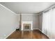 Open living room with hardwood floors, fireplace, and bright natural light at 2905 N Warman Ave, Indianapolis, IN 46222