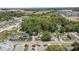 A high-angle view reveals a neighborhood setting with mature trees surrounding well-maintained homes at 301 S Main St, Whitestown, IN 46075