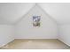 Finished attic space with a window, offering natural light and potential for versatile use at 301 S Main St, Whitestown, IN 46075
