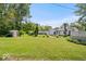 Spacious backyard featuring green lawn, shed, and patio perfect for outdoor activities and gatherings at 301 S Main St, Whitestown, IN 46075