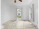 Bright bedroom with white walls, hardwood floors, and large windows, offering a blank canvas for customization at 301 S Main St, Whitestown, IN 46075